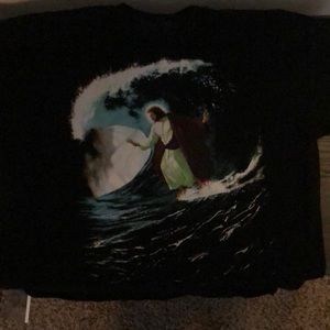 Black, Jesus surfing on water t shirt.